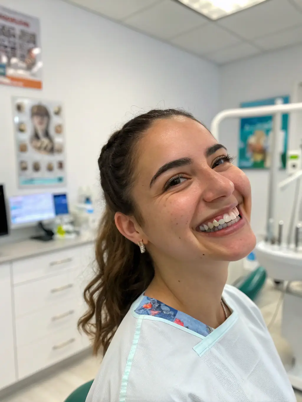 A patient smiling confidently after completing Invisalign treatment at White Pearl Dental Practice, showcasing the discreet and effective teeth straightening solution.
